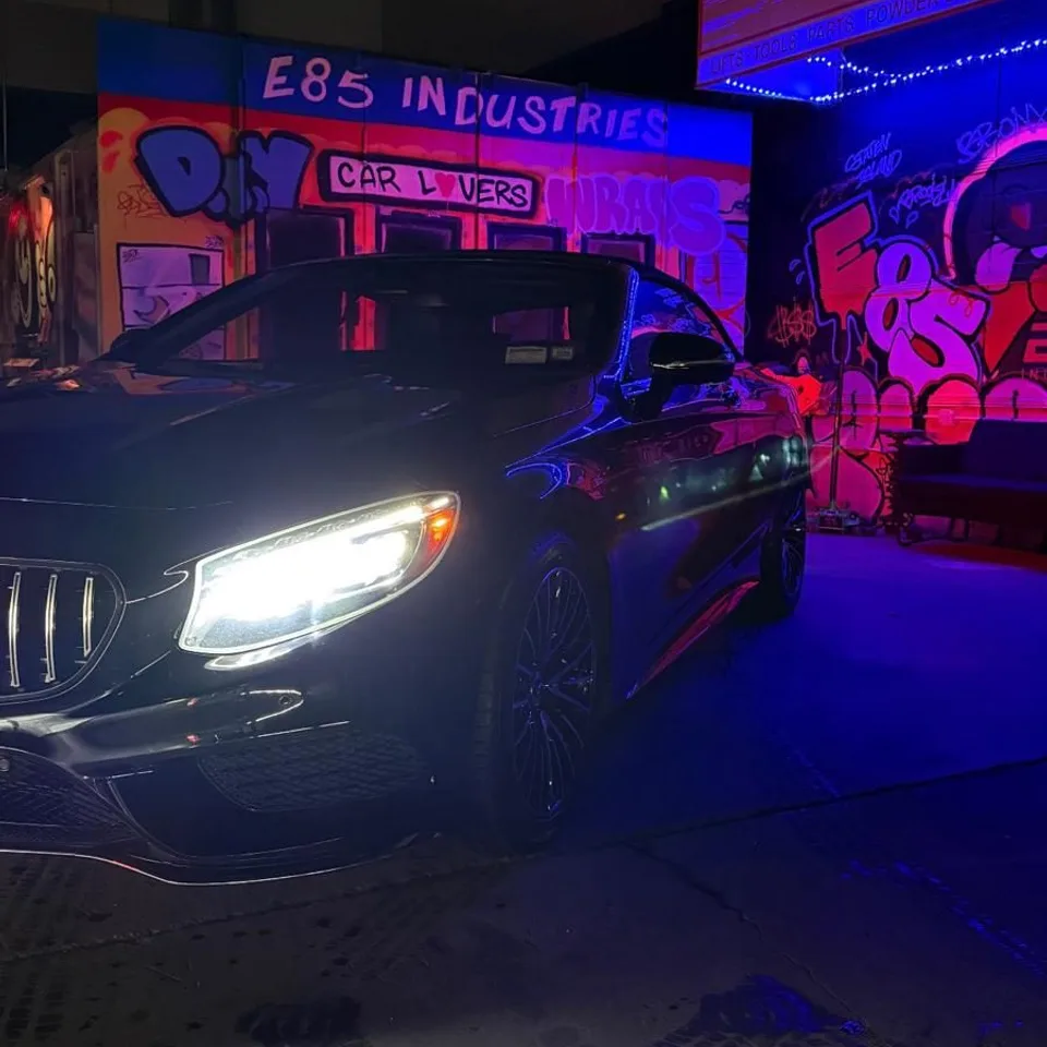 Car with LED headlights at night